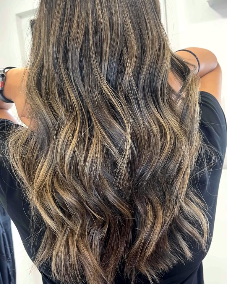 Long brunette hair with beige blonde balayage by Hair By Neetu